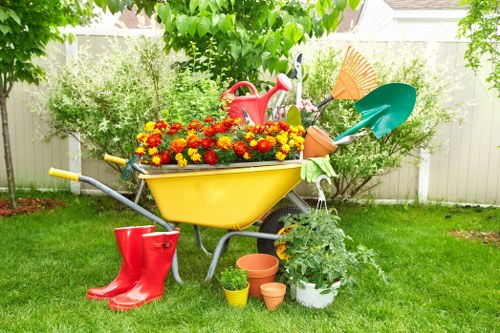 Garden maintenance in Kingsbury with tidy lawn and shrubs